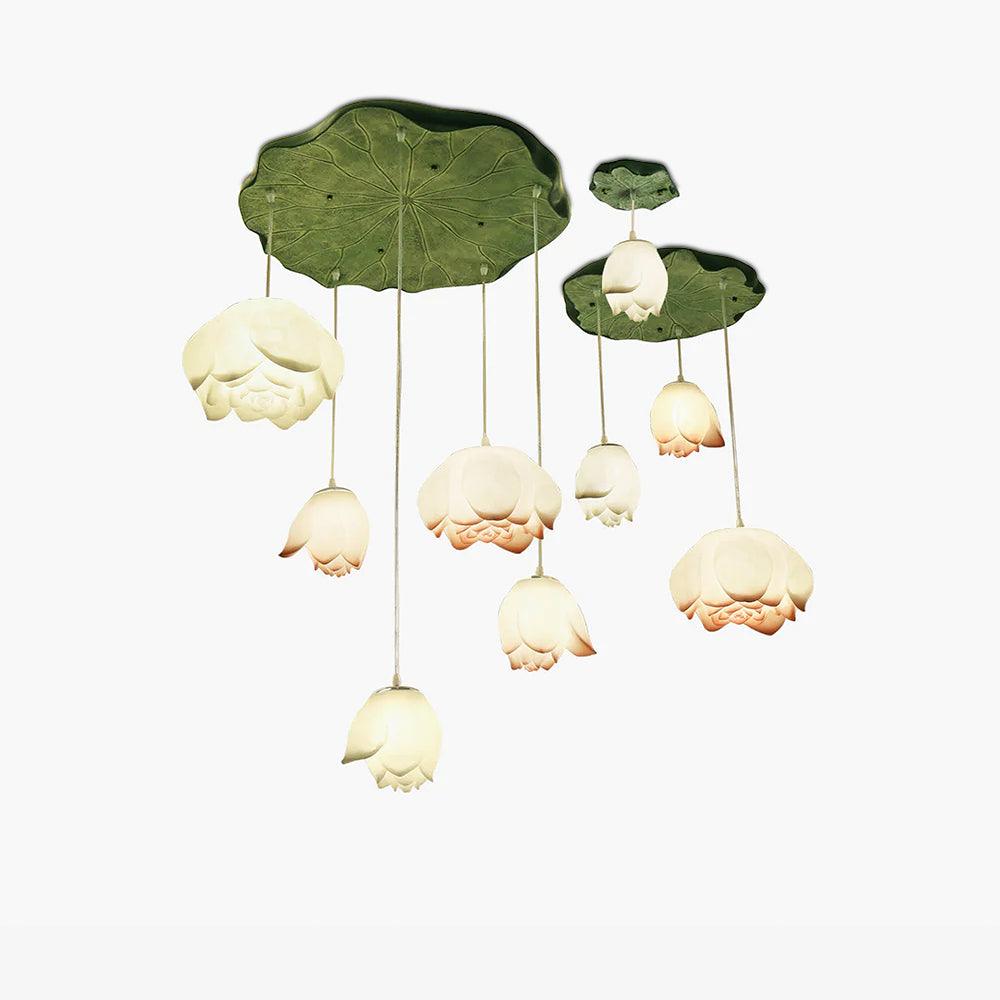 Cut-out view of the full Clérachic water-lily pendant cluster on white, with white and pink-tipped buds under two lily-pad canopies.