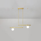Clérachic gold pendant with two globes on offset bars, hanging from a ceiling plate against a pale grey wall.
