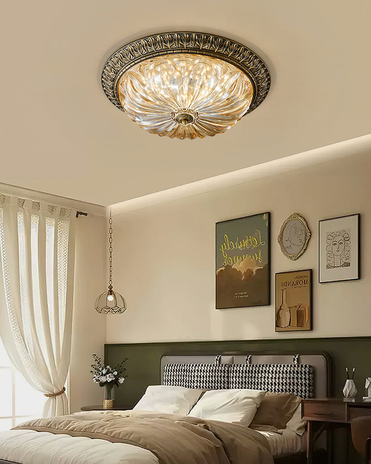 Lit Clérachic flush light above a bed with a green wall, framed posters and a cream curtain beside the window.