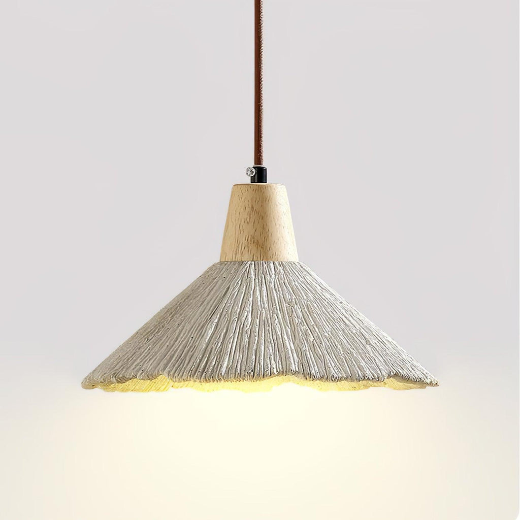 Close view of this Clérachic pendant from below, its wide grey shade lit warmly beneath a wooden cap and a braided cord.