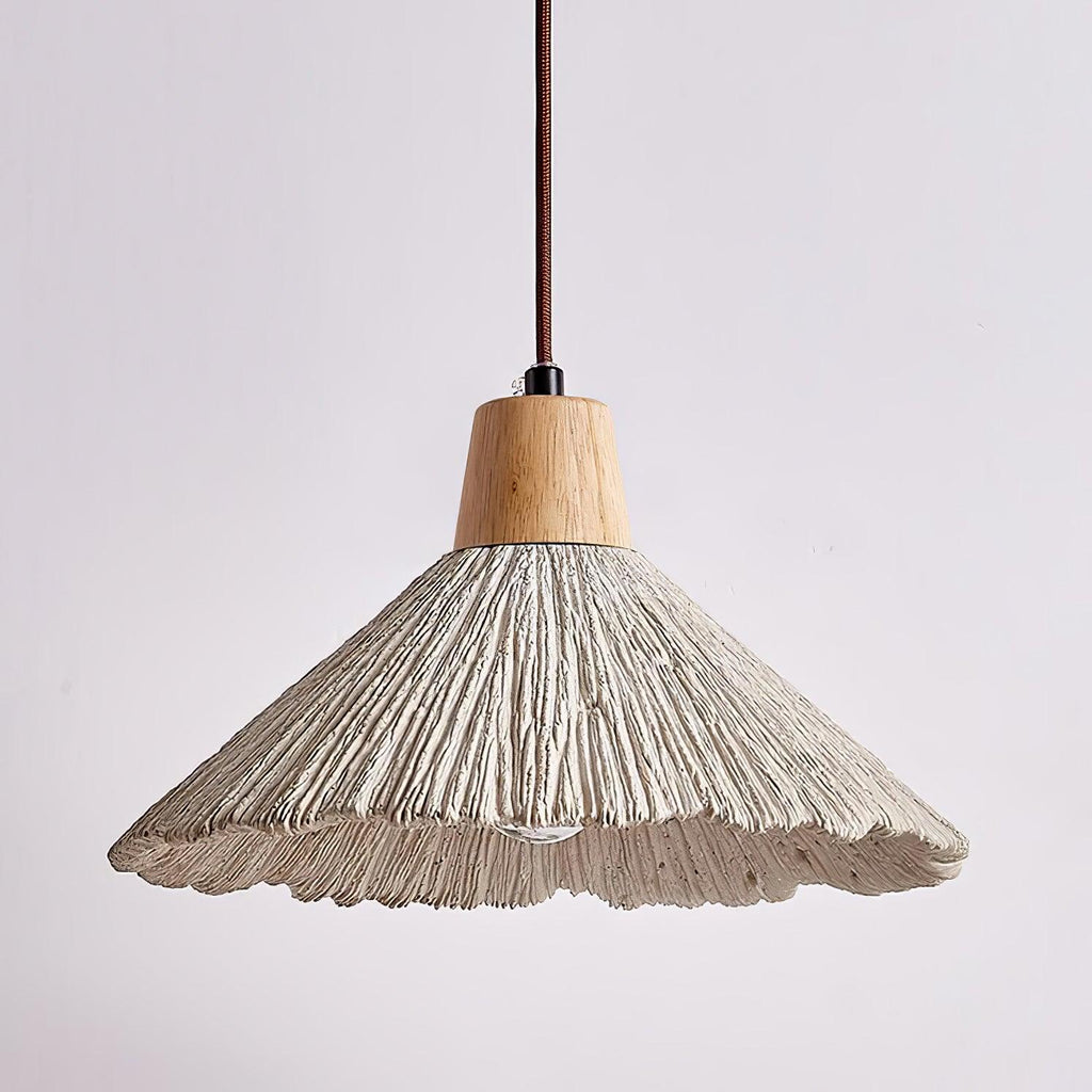 A wide Clérachic pendant seen from slightly below, its scalloped grey rim and ridged shade clear against a soft background.