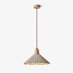 Wide-shade Clérachic pendant with a wooden cap and a brown cord, shown on a plain light backdrop and lit warm underneath.