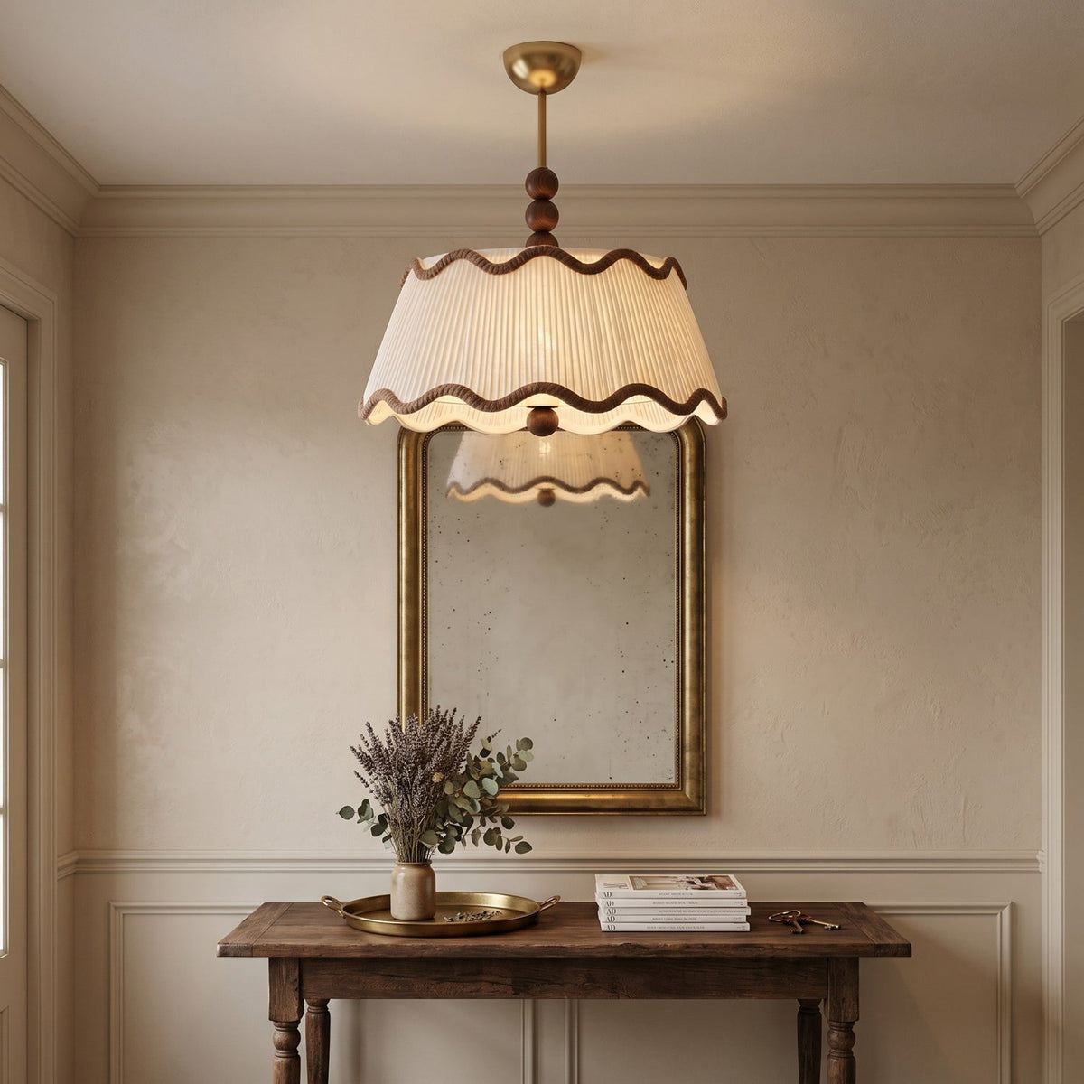 Clérachic pleated ceiling light with wood beads, lit above a gold-framed mirror and a wooden console with dried lavender.