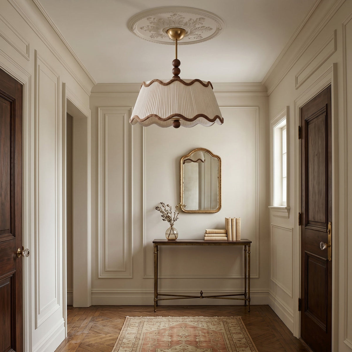 Clérachic beaded pendant-style ceiling light hanging beneath a plaster rose in a panelled hallway with dark wooden doors.