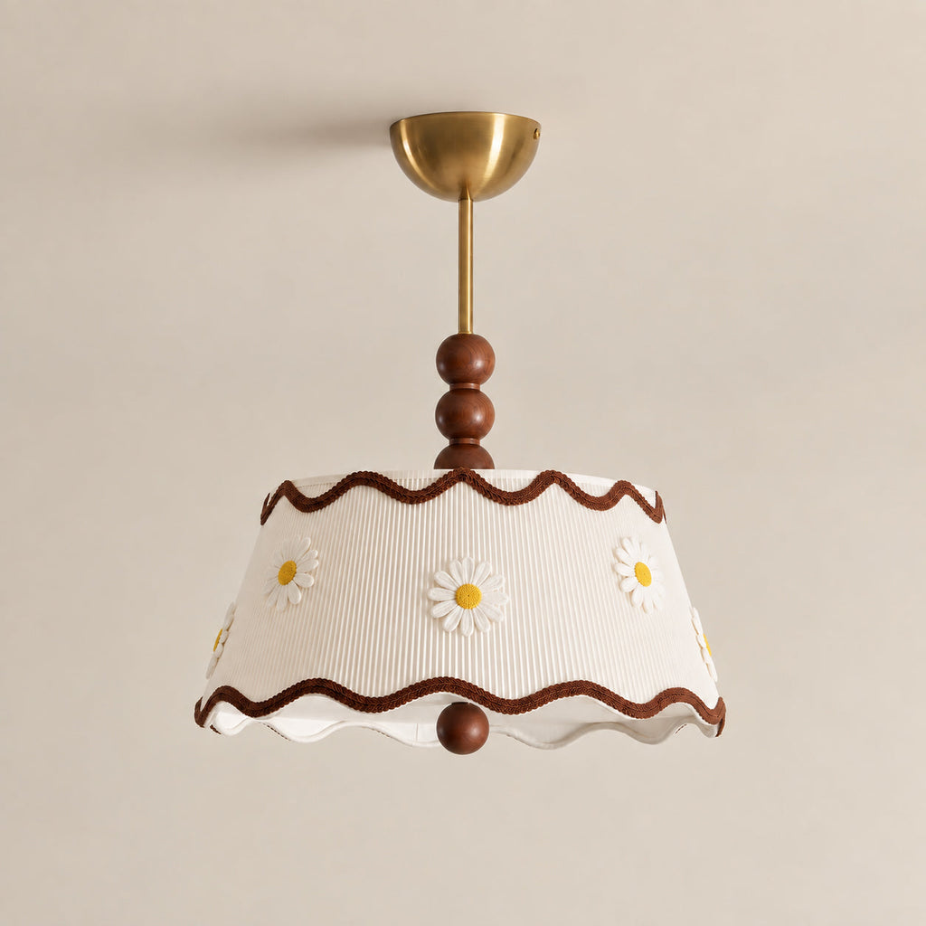 Clérachic ceiling light in a white pleated version with small embroidered daisies, wavy brown trim, wood beads and a brass canopy.