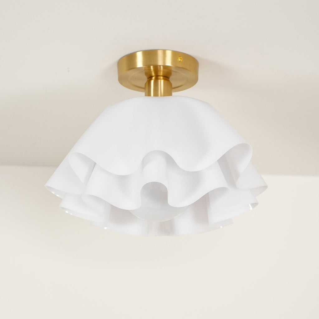 The Clérachic Pleated Petal Ceiling Light unlit, showing the chalk-white matte petals and the scalloped gaps between each layer.