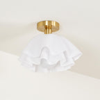 Seen from below on a cream ceiling, the Clérachic Pleated Petal Ceiling Light shows three ruffled tiers and the bulb tucked inside.