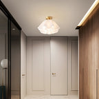 The Clérachic Pleated Petal Ceiling Light lights a panelled corridor between a mirrored wardrobe and warm wood cabinetry.