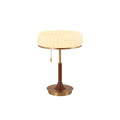 Cut-out view of this Clérachic table lamp, with its pleated cream shade, pull chain, walnut stem and round gold base.