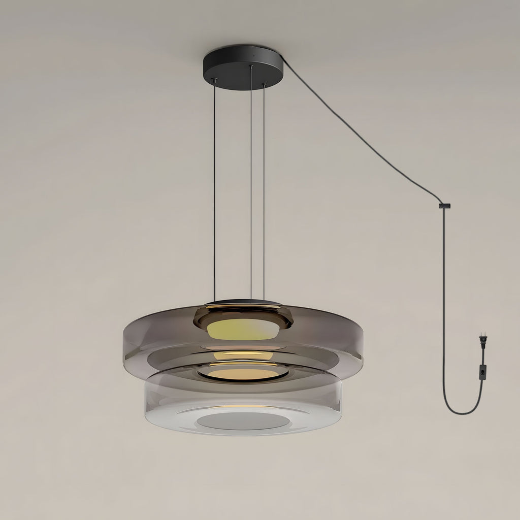 Two tiers of smoke-grey glass stack on this Clérachic pendant, shown with its cord and plug.