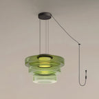 Three tiers of green glass stack on this Clérachic pendant, shown with its cord and plug.