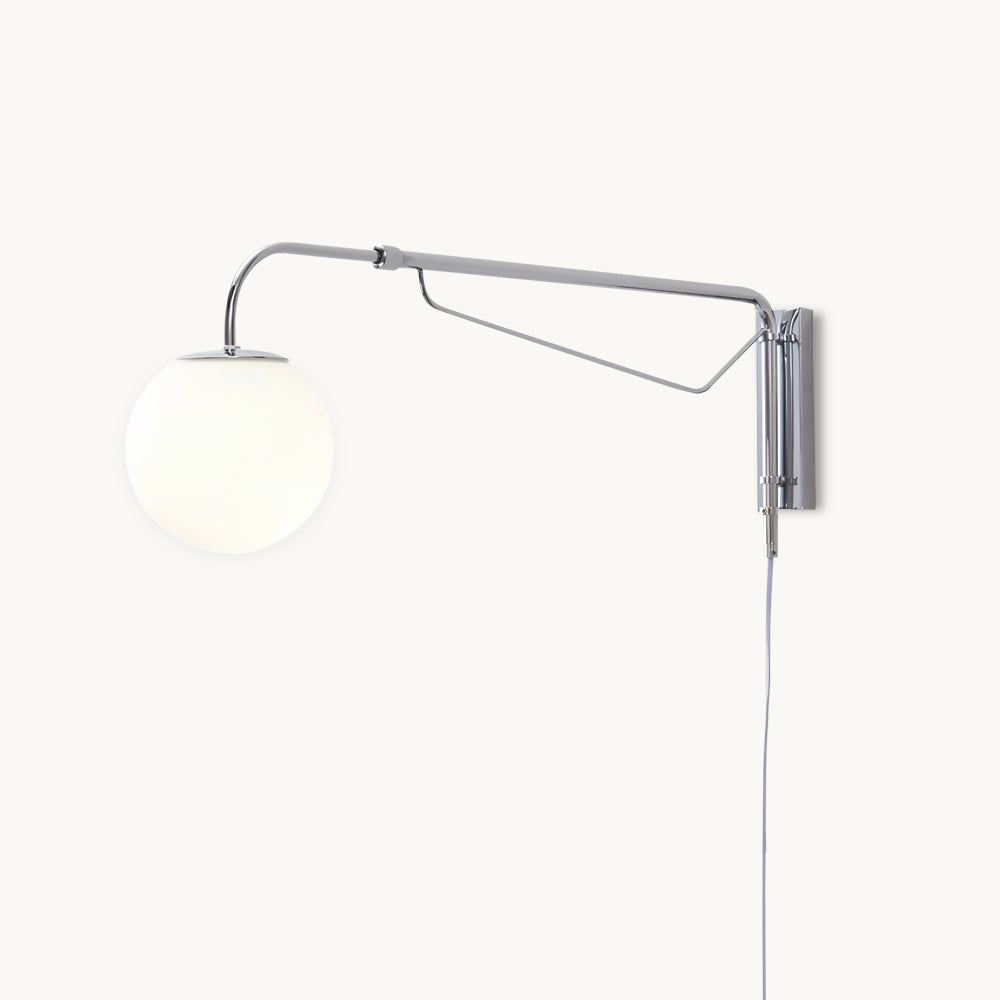 Front view of this Clérachic plug-in wall light on a white backdrop, with a chrome swing arm, a white globe and a slim cord hanging down.