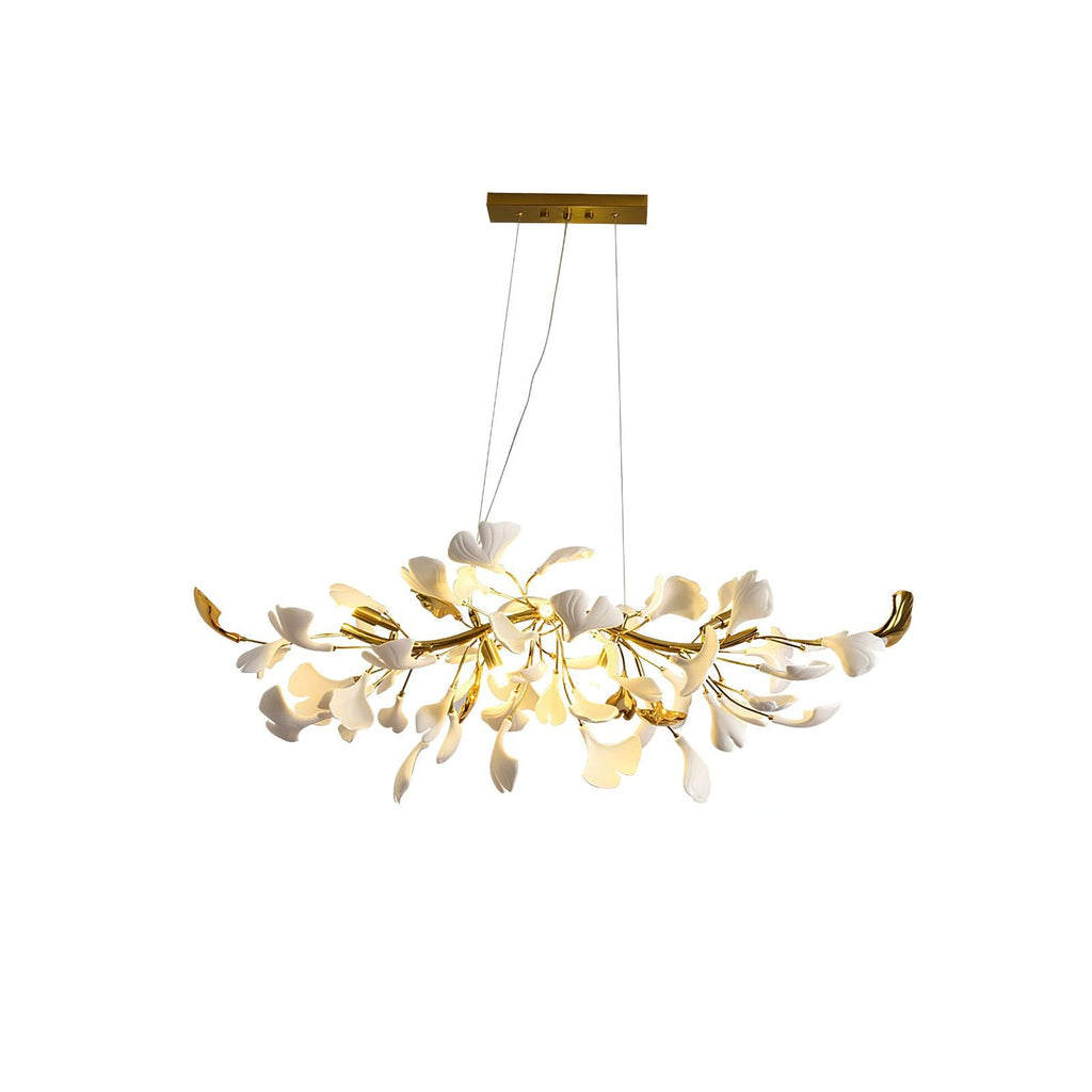 Clérachic chandelier with lit white leaves and gold curved ends, shown whole beneath a gold canopy on a white backdrop.