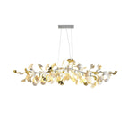 Clérachic chandelier with a nickel-toned canopy and branch, white and silver leaves lit, on a plain white backdrop.