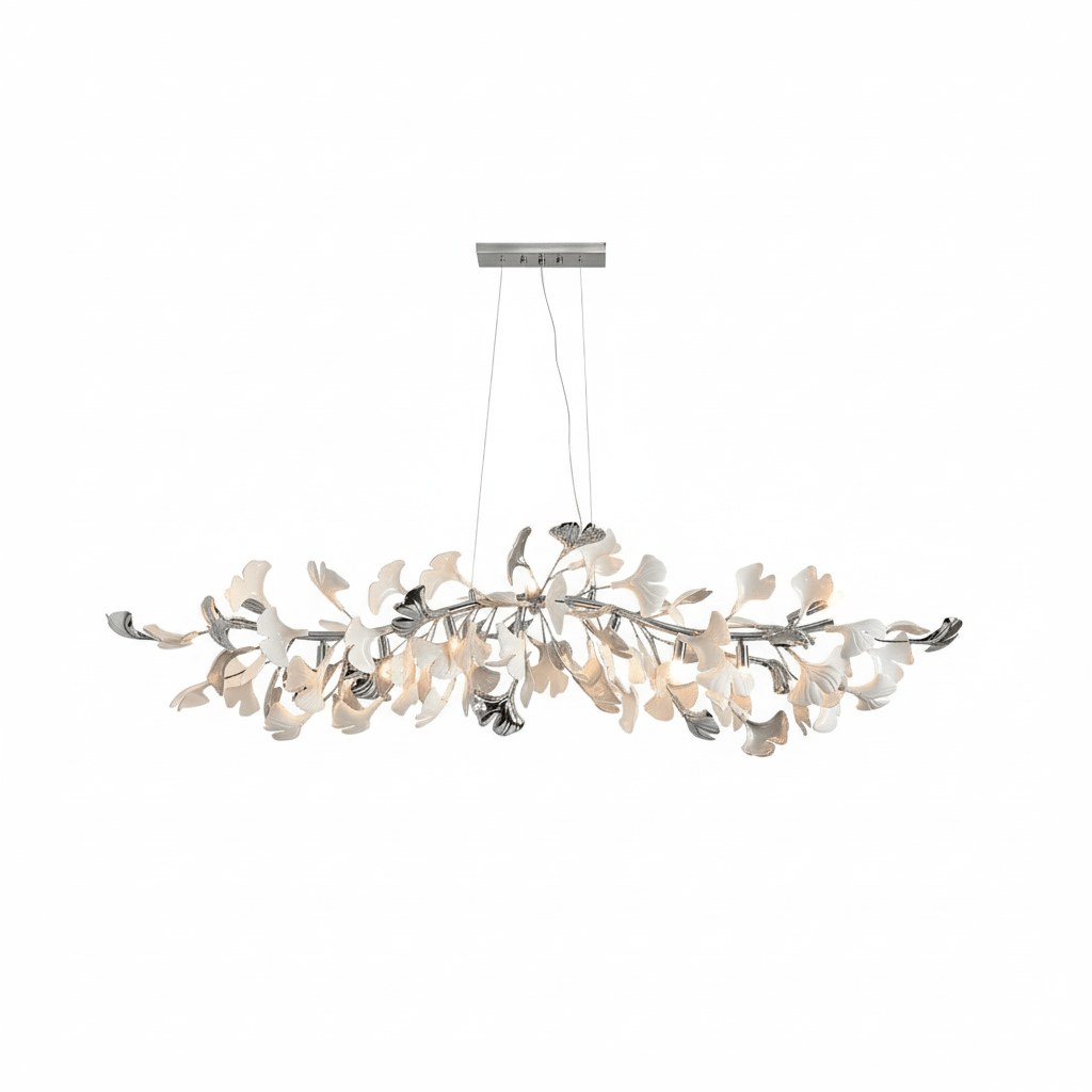 Clérachic chandelier with white and silver leaves along a nickel branch, softly lit, on a plain white backdrop.
