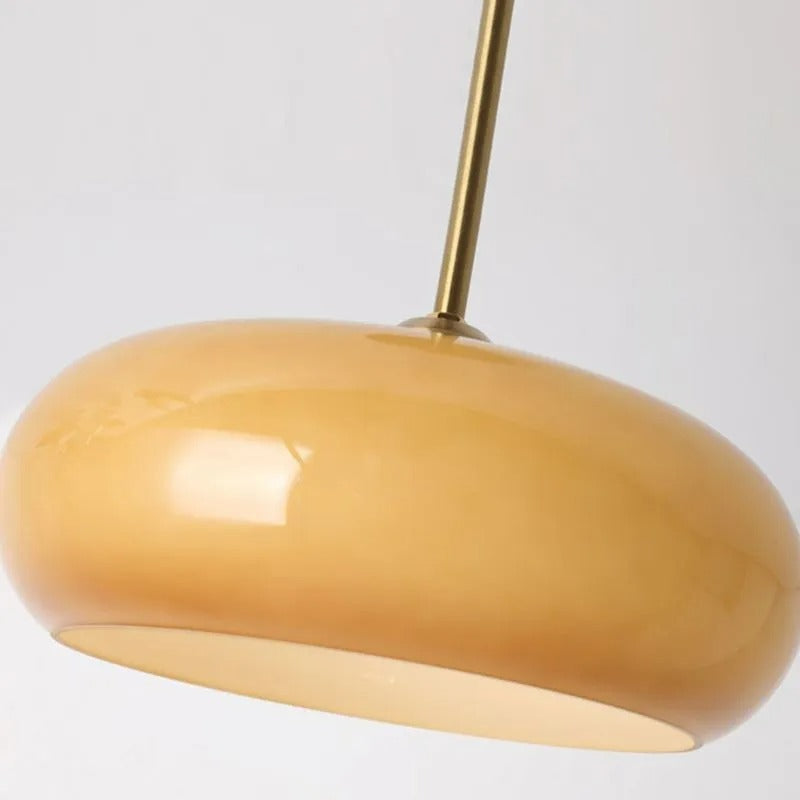 Underside close-up of the Clérachic Puffed Oval Glass Ceiling Light, honey glass over its flat frosted diffuser disc.