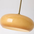 Underside close-up of the Clérachic Puffed Oval Glass Ceiling Light, honey glass over its flat frosted diffuser disc.