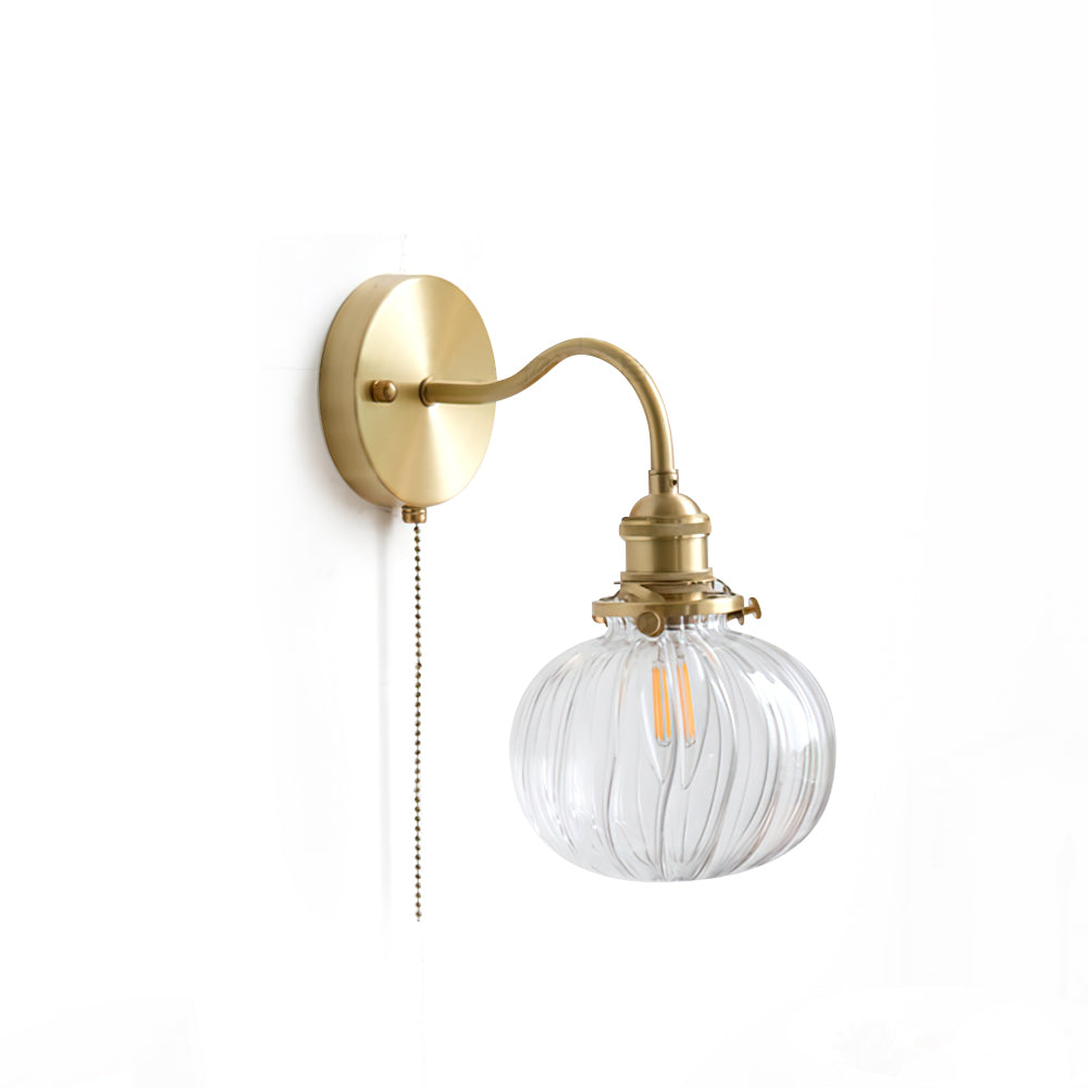 Studio view of the Clérachic Pull-Chain Brass Wall Sconce on white, showing the round backplate, gooseneck arm and clear fluted globe.