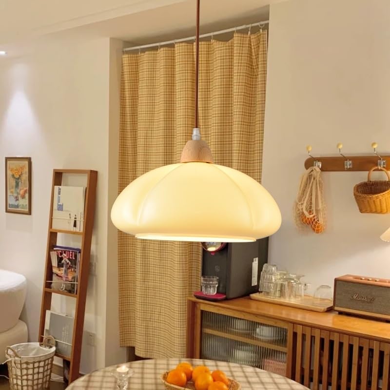 Clérachic pendant light in a room setting over a dining table.