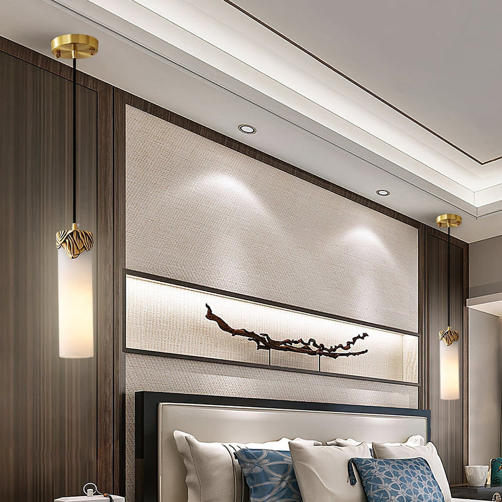 A pair of Clérachic Quiver Pendant Lights flanking a bed, one hung each side of the headboard in place of table lamps.