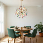 Clérachic agate chandelier above a round wooden dining table with green chairs, beside a sheer-curtained window.