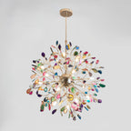 Multicolour agate Clérachic chandelier hanging against a pale grey backdrop, with a gold sphere at its centre.