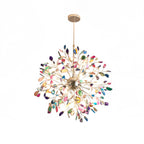 Multicolour agate Clérachic chandelier on a plain white backdrop, hanging from a slim gold rod.