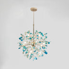 Clérachic agate chandelier with blue and teal slices on a pale grey backdrop, its gold branches spreading from a central sphere.