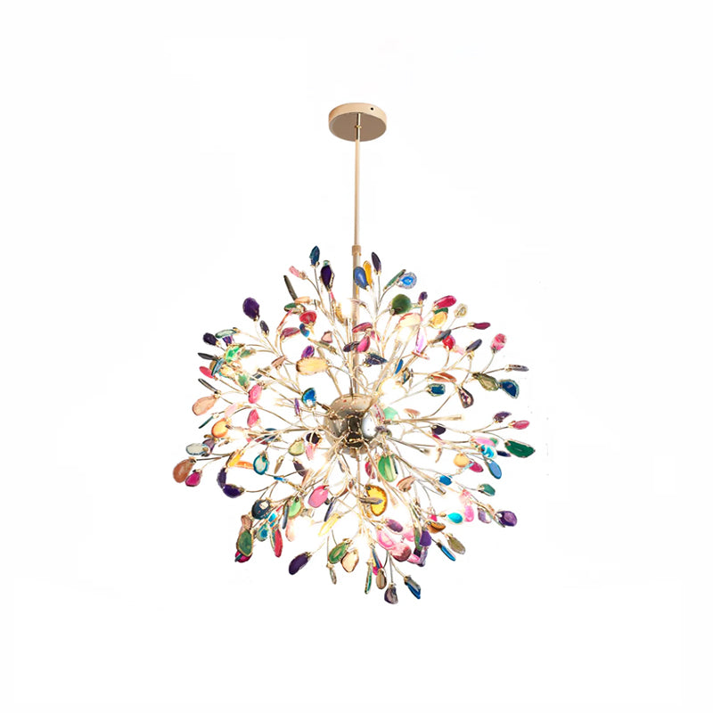 Multicolour agate Clérachic chandelier on a white backdrop, lit, with slices in blue, pink, green and orange.