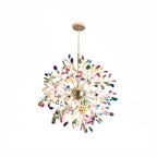 Multicolour agate Clérachic chandelier on a white backdrop, lit, with slices in blue, pink, green and orange.