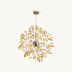 Amber agate Clérachic chandelier on a cream backdrop, with honey-coloured slices on gold branches and a lit gold sphere.