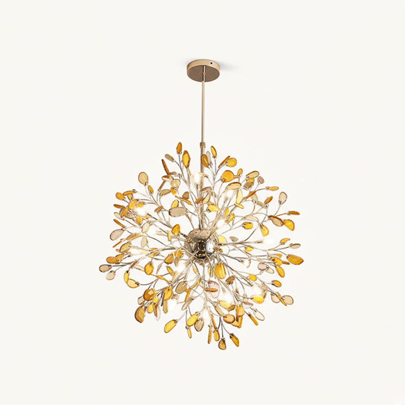 Amber agate Clérachic chandelier on a cream backdrop, with honey-coloured slices on gold branches and a lit gold sphere.