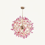 Pink agate Clérachic chandelier on a cream backdrop, with rose and magenta slices on fine gold branches.