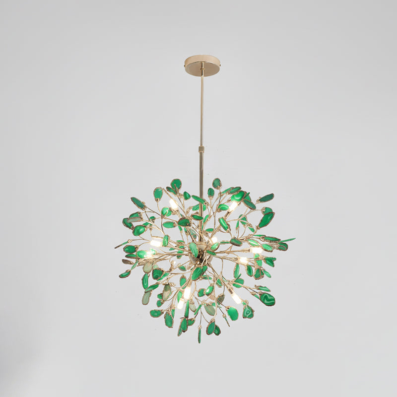Green agate Clérachic chandelier on a pale grey backdrop, lit, hanging from a gold rod and round canopy.