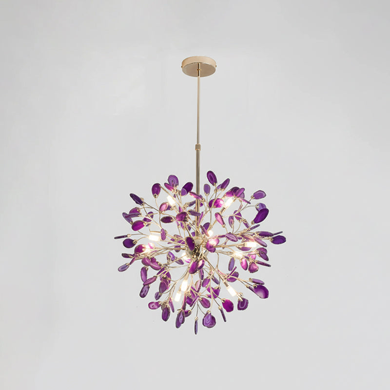 Purple agate Clérachic chandelier on a pale grey backdrop, lit, hanging from a gold rod and round canopy.