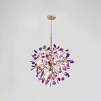 Purple agate Clérachic chandelier on a pale grey backdrop, lit, hanging from a gold rod and round canopy.