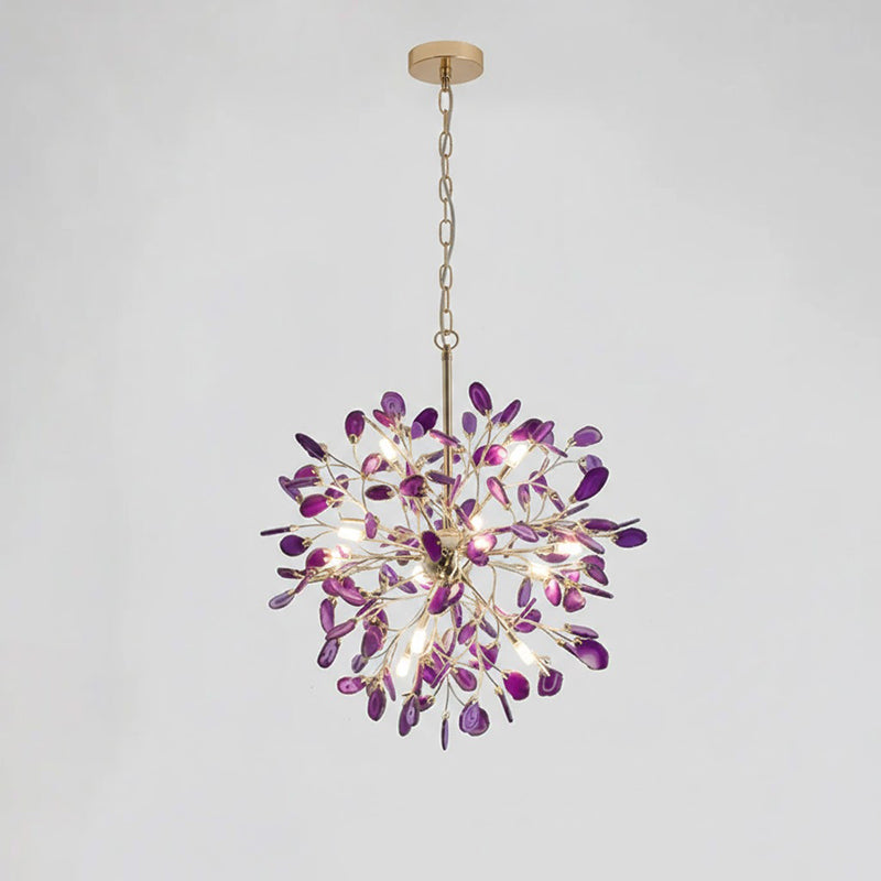 Purple agate Clérachic chandelier hanging from a gold chain on a pale grey backdrop, with violet slices and bright bulbs.