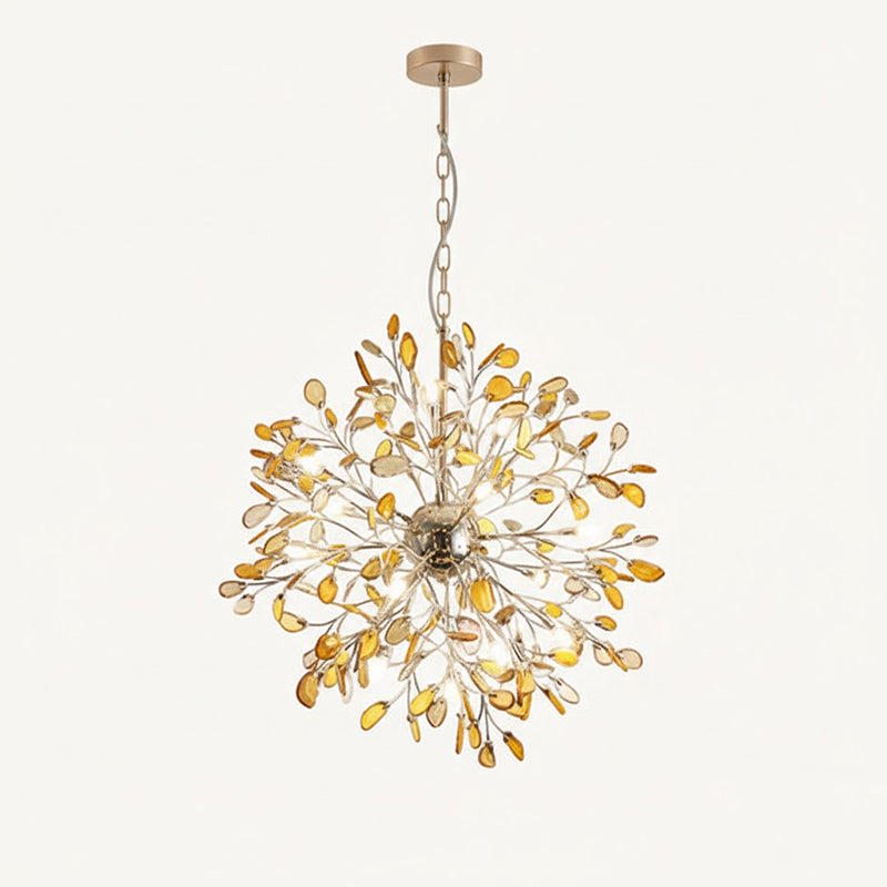 Amber agate Clérachic chandelier hanging from a chain on a cream backdrop, with honey-coloured slices around a gold sphere.