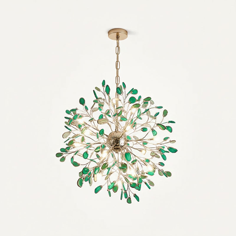 Green agate Clérachic chandelier hanging from a chain on a cream backdrop, with deep green slices around a gold sphere.