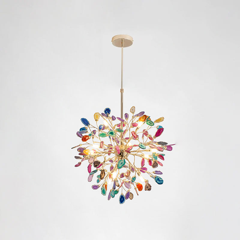 Clérachic agate chandelier on a chain, with multicolour slices in blue, green, orange and pink on a pale grey backdrop.