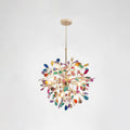 Clérachic agate chandelier on a chain, with multicolour slices in blue, green, orange and pink on a pale grey backdrop.