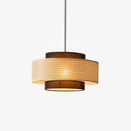 Two-tier Clérachic pendant with a natural rattan cane drum and brown fabric top and base, lit warm on a plain white backdrop.