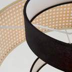 Close view of the rattan drum and the underside of the fabric tier on this Clérachic pendant, from below.