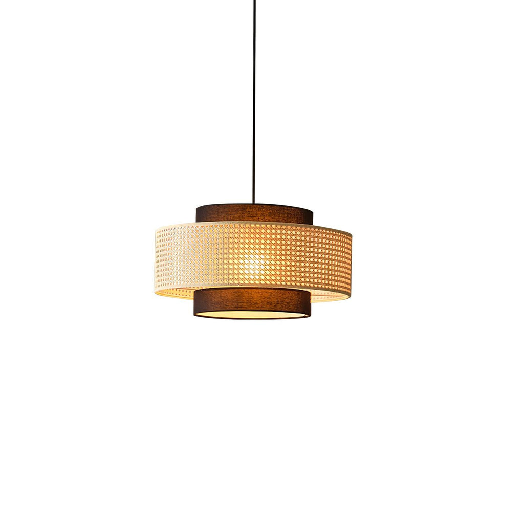 A Clérachic rattan pendant shown straight on, with its brown top tier and brown fabric base against a white backdrop.