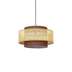 Underside view of this Clérachic pendant on a white backdrop, with the cane drum and the brown fabric base unlit.