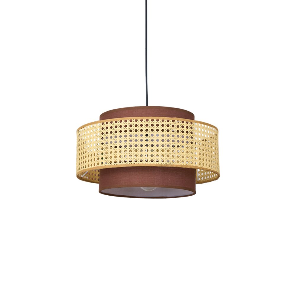 Underside view of this Clérachic pendant on a white backdrop, with the cane drum and the brown fabric base unlit.