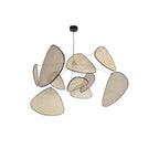 A studio shot on a plain white backdrop shows this Clérachic pendant's bamboo-weave paddles held by a black wire frame.