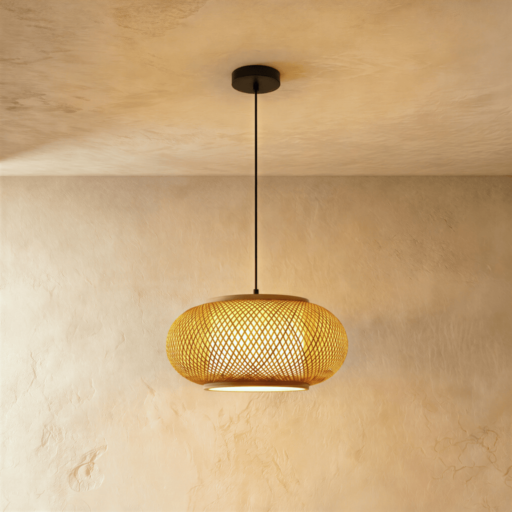 Clérachic woven pendant light in a flattened lantern shape with a crosshatch weave, lit warm on a black cord.