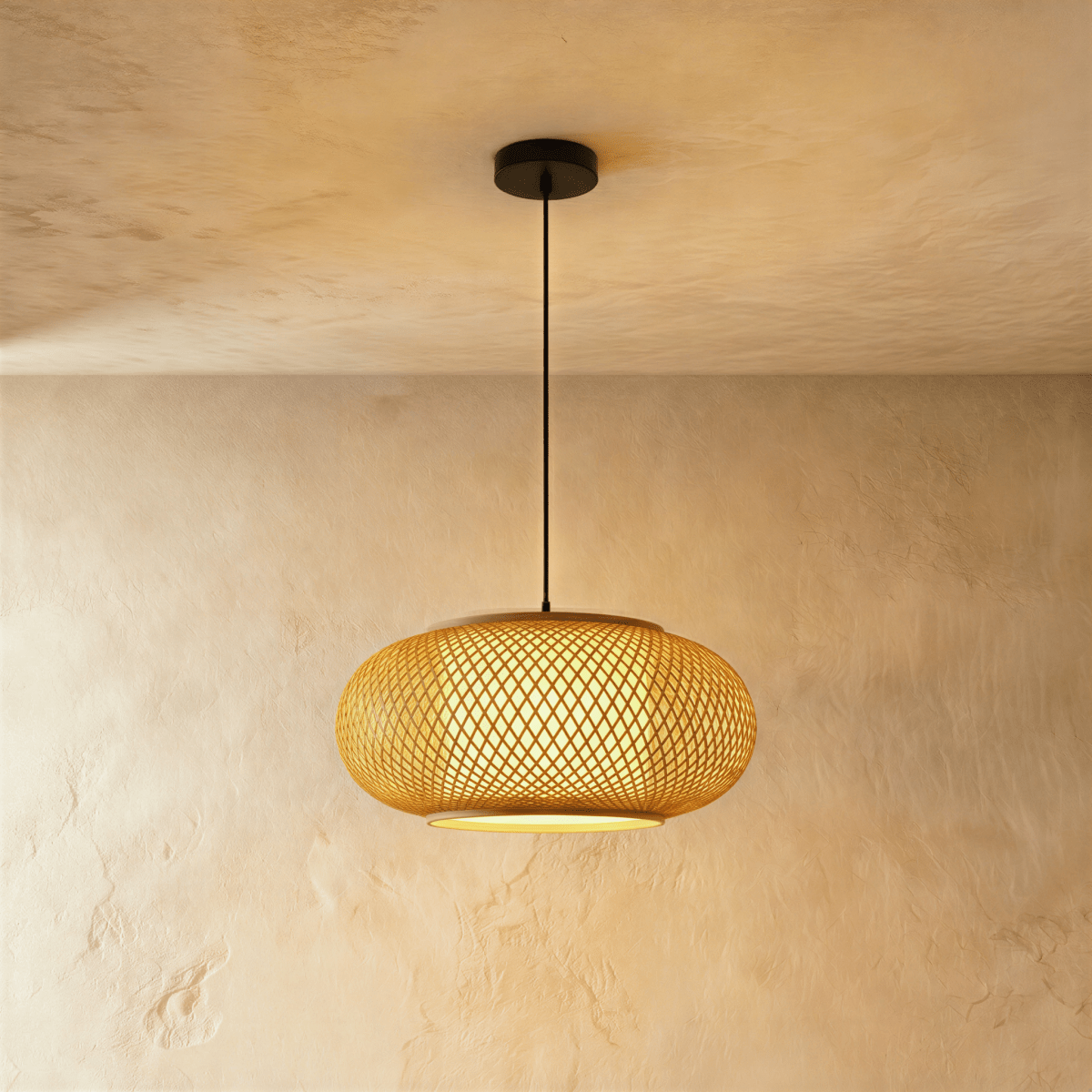 Clérachic mid-size woven pendant light with a wide crosshatch weave and a lit diffuser disc below, on a black cord.