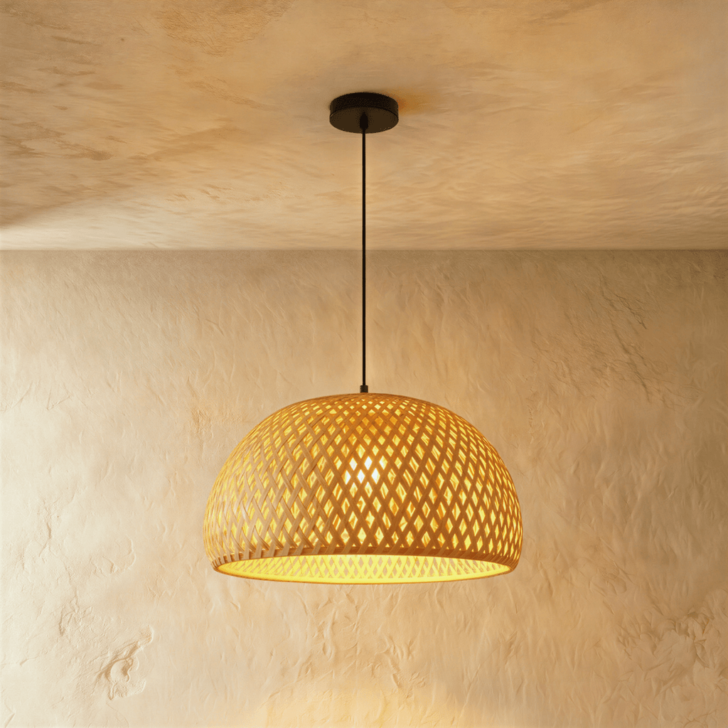 Clérachic mid-size woven dome pendant light, open diamond weave lit from within, hanging from a black canopy.